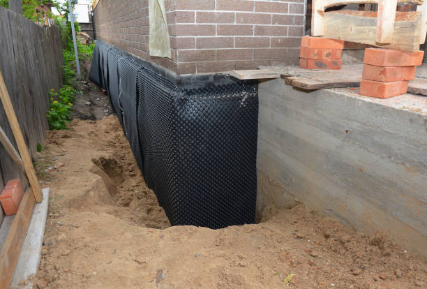 SJ Waterproofing Pros technician performing targeted Foundation Crack Repair assessment in Iron City, TN